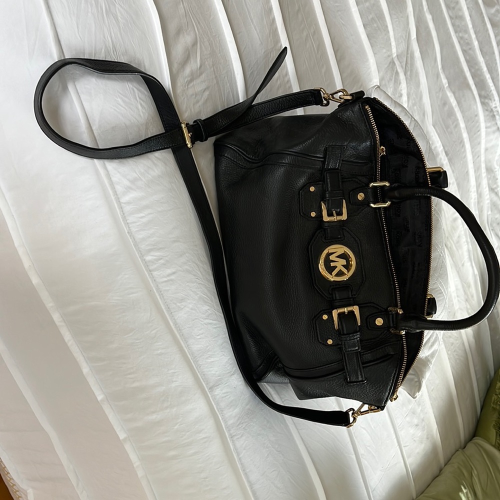 Michael Kors Black Handbag 17 “L x11 “ H x 7 “W. Strap is 46 “ Never Used !!